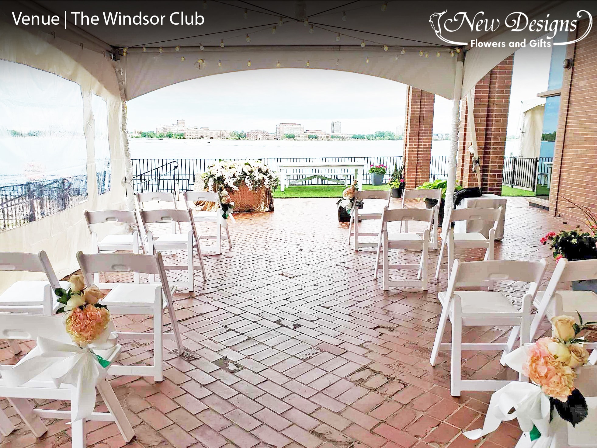 A wedding Aisle, at an outdoor waterfront venue, The chairs along the aisle adorned with Floral installments of Dusty Pink Hydrangeas, White Peonies, and Nude Roses tied with a satin bow. At the front sits a table with a gold sequined tablecloth, overflowing with White Roses and Phalaenopsis Orchids.